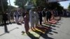 Men attend the Eid al-Fitr prayers outside a mosque in Kabul, Afghanistan, May 24, 2020. 