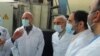 FILE - A picture provided by Iran's Atomic Energy Organization shows Iranian Parliament speaker Mohammad Bagher Ghalibaf, left, and head of the Iranian Atomic Organization Ali Akbar Salehi, right, at the Fordo Uranium Conversion Facility, Jan. 28, 2021.