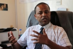FILE - Abebe Shibru, Marie Stopes International Country Director for Zimbabwe in Harare, Jan, 23, 2018. Marie Stopes used to treat 150,000 women a year, but that is cut in half because of funding, including President Donald Trump's global gag rule.