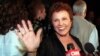 Maria Elena Holly, Buddy Holly's widow, arrives at the Buddy Holly Tribute and Rock and Roller Dance Party at New York's Roseland Ballroom, Sept. 7, 1999. 