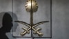 FILE - The shadow of a security guard is seen on the entrance door of the Saudi Arabia's consulate in Istanbul, on Oct. 12, 2018.