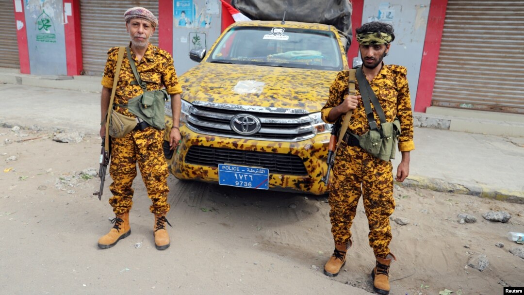 FILE - Houthi-allied police secure a street in Hodeida, Yemen, Dec. 31, 2018.