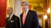 U.S. Secretary of State John Kerry, right, walks to a meeting with France's Foreign Minister Laurent Fabius at the Quai d' Orsay in Paris, March 27, 2013.