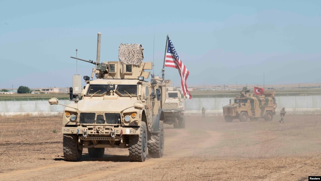 U.S. and Turkish military forces conduct a joint ground patrol inside the security mechanism area in northeast, Syria, September 8, 2019. Picture taken September 8, 2019. U.S. Army/Spc. Alec Dionne/Handout via REUTERS. THIS IMAGE HAS BEEN SUPPLIED BY A THIRD PARTY.