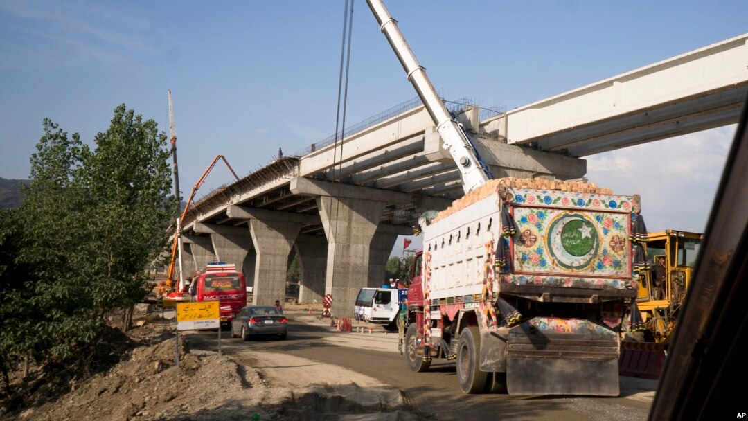 FILE - Construction work is in progress at a new international trade route which part of a sprawling Chinese initiative to build a "new Silk Road" of ports, railways, and roads to expand trade in a vast arc of countries across Asia, Africa and Europe, near Havalian Pakistan, May 11, 2017.