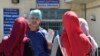 A doctor gestures outside a hospital in the Algerian town of Boufarik, as the country faces a cholera outbreak, Aug. 28, 2018.
