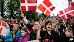 FILE - People in Tivoli in Copenhagen Denmark, May. 19, 2013. The United Nations made it official on March 16, 2016: It found Danes to be the happiest people on Earth, in a study of 156 countries.