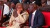 Tanzania's President Samia Suluhu Hassan talks with her Kenyan counterpart William Ruto as they attend the Africa Energy Summit in Dar es Salaam, Tanzania, Jan. 28, 2025.
