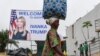 A woman walks past a sign with a portrait of Ivanka Trump before she takes part in the first West African summit on female entrepreneurship, in Adzope, north of Abidjan on April 17, 2019.
